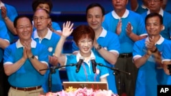 Backed by the ruling Nationalist Party members, Hung Hsiu-chu, deputy legislative speaker, waves as she is nominated as the party's candidate in the January presidential election, July 19, 2015, in Taipei, Taiwan.