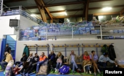 People rest following an earthquake in Amatrice, central Italy, Aug. 24, 2016.