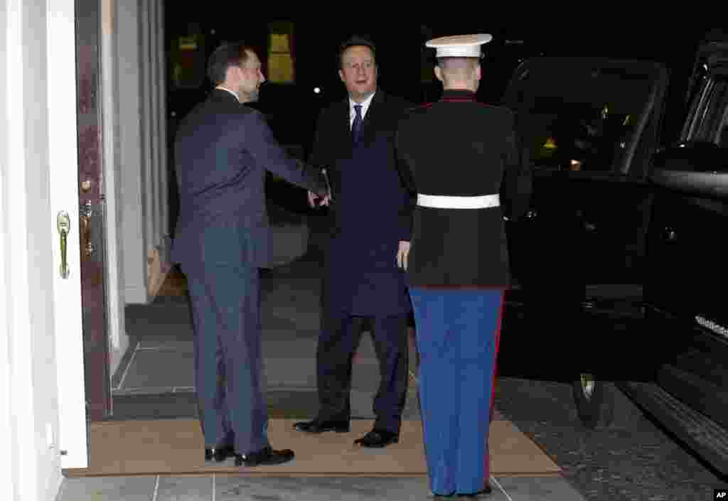 British Prime Minister David Cameron arrives at the West Wing of the White House for a working dinner with President Barack Obama, Jan. 15, 2015.