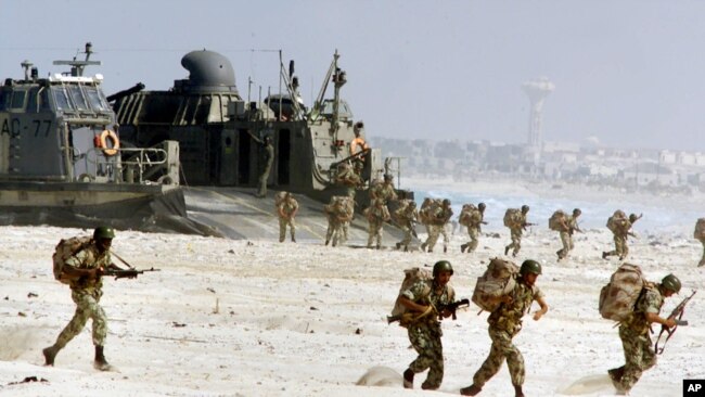 FILE - Egyptian troops come ashore from a U.S. hovercraft on the Egyptian coast near Alexandria as a part of an amphibious operation during the Bright Star maneuvers Oct. 23, 2001.