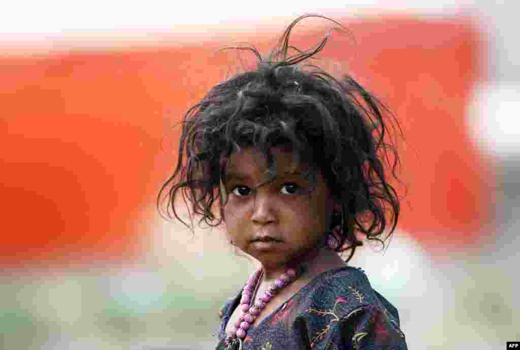 A displaced Yemeni child looks on at a make-shift camp for displaced people on the outskirts of Sana&#39;a, May 21, 2018.