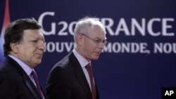 European Commission President Jose Manuel Barroso, left, and European Council President Herman Van Rompuy arrive at a G20 meeting in Cannes, Thursday, Nov.3, 2011.