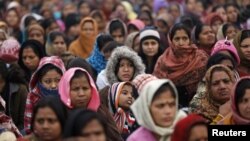 FILE - Women attend a prayer ceremony after a rally pushing for justice and security for women at Raj Ghat in New Delhi, Jan. 2, 2013.