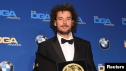 Garth Davis, winner of the First-Time Feature Film award for his work on "Lion," poses for photographers at the 69th annual DGA Awards in Beverly Hills, California, Feb. 4, 2017.