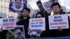 South Korean protesters and North Korean defectors hold portraits of North Korean leader Kim Jong Un during a rally near the U.S. embassy in Seoul, South Korea, urging the United States to discuss North Korean human rights issue in the upcoming Trump-Kim summit, Feb. 26, 2019.