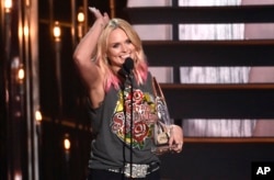 FILE - Miranda Lambert accepts the award for female vocalist of the year at the 49th annual CMA Awards at the Bridgestone Arena in Nashville, Tenn., Nov. 4, 2015.