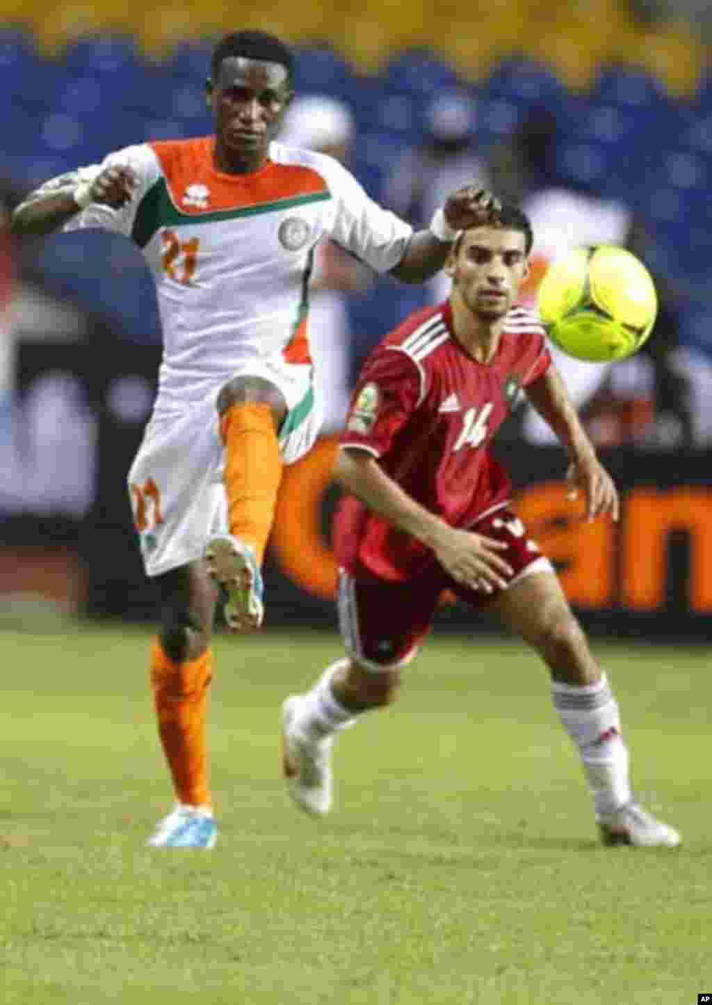 Niger's Seydou Ali Yacouba (21) plays against Morocco's Mbark Boussoufa (14) during their final African Cup of Nations Group C soccer match at the Stade De L'Amitie Stadium in Libreville, Gabon, January 31, 2012.