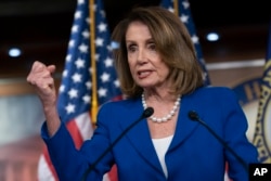 FILE - House Speaker Nancy Pelosi reacts to a letter by Attorney General William Barr about special counsel Robert Mueller's report during a news conference on Capitol Hill in Washington, March 28, 2019.