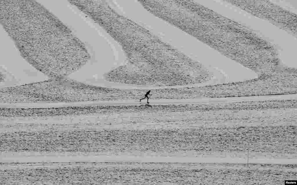 A cross-country skier is seen on the Dachstein glacier, as a heatwave hits the country, near Ramsau, Austria.