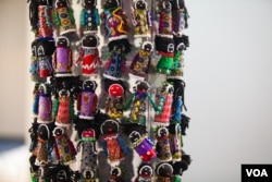 The Orphan Tower, a tower of small beaded cloth dolls, is set up at the AIDS conference. The tower signifies the number of young children orphaned by AIDS in South Africa -- the current number is 3.7 million. (Alison Klein/VOA)