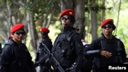 FILE - Indonesian Army's Kopassus special forces patrol outside the venues of the Asia-Pacific Economic Cooperation (APEC) Summit in Bali, Oct. 5, 2013. 