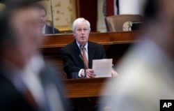 Texas Rep. Charlie Geren, R-Fort Worth, answers questions as the Texas House debates an anti-sanctuary-cities bill that seeks to jail sheriffs and other officials who refuse to help enforce federal immigration law, in Austin, April 26, 2017. The Legislature completed approval of the bill May 3, 2017.