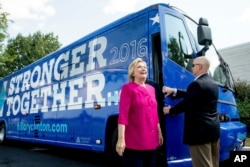 Democratic presidential candidate Hillary Clinton gets off her campaign bus as she arrives for a rally at K'NEX, a toy company in Hatfield, Pa., July 29, 2016.