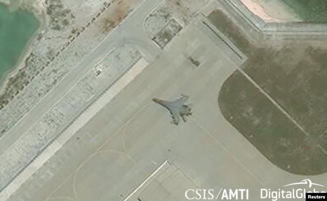 Satellite imagery shows the deployment of several new weapons systems, including a J-11 combat aircraft, at China’s base on Woody Island in the Paracels, South China Sea, May 12, 2018.
