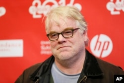 Cast member Philip Seymour Hoffman poses at the premiere of the film "A Most Wanted Man" during the 2014 Sundance Film Festival in Park City, Utah, Jan. 19, 2014.