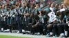 US Football Players Defy Trump, Protest During National Anthem