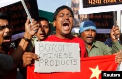 Traders protest against China in the western Indian city of Ahmedabad on May 3, 2013. They were demanding the withdrawal of Chinese soldiers who set up camp in a remote territory in the Himalayas that is claimed by India.
