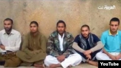 FILE - Iranian border guards purportedly captured by the Pakistani group Jaish al-Adl.