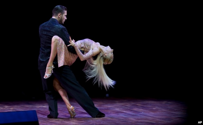 Kirill Parshakov and Anna Gudyno, from Russia, compete in the stage category at the World Tango Championship final in Buenos Aires, Argentina, Thursday, Aug. 27, 2015. (AP Photo/Natacha Pisarenko)