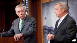 Senate Minority Leader Harry Reid of Nevada, left, and Senate Minority Whip Richard Durbin of Illinois answer questions for reporters following the Senate vote on the Iran nuclear agreement on Capitol Hill in Washington, Sept. 10, 2015.