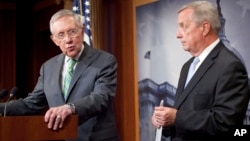 Senate Minority Leader Harry Reid of Nevada, left, and Senate Minority Whip Richard Durbin of Illinois answer questions for reporters following the Senate vote on the Iran nuclear agreement on Capitol Hill in Washington, Sept. 10, 2015.