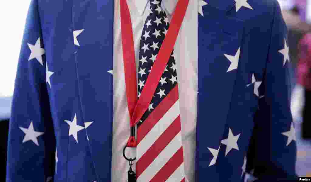 A man wears a suit with stars and an American flag tie at the 2016 Conservative Political Action Conference (CPAC) at National Harbor, Maryland.