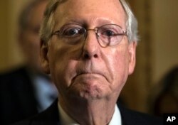 Senate Majority Leader Mitch McConnell of Kentucky tells reporters he is delaying a vote on the GOP health care bill at the Capitol in Washington, June 27, 2017. Some of McConnell's fellow Republican senators, citing a long to-do list, are telling him it might be wise to cancel some of the congressional recess.