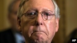 FILE - Senate Majority Leader Mitch McConnell of Kentucky tells reporters he is delaying a vote on the GOP health care bill at the Capitol in Washington, June 27, 2017. More than three weeks later, Senate Republicans are still trying to reach agreement on an overhaul measure. 