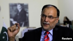 FILE - Ahsan Iqbal, Pakistan's interior minister, speaks with Reuters in Islamabad, June 12, 2017.