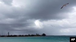 Skies darken as Hurricane Joaquin passes through the region, seen from Nassau, Bahamas, early Friday, Oct. 2, 2015.