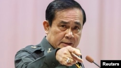 FILE - Thailand's Prime Minister Prayuth Chan-ocha gestures as he speaks during an event titled "The Instruction on the Procedures of Members of the National Reform Council" at the Army Club in Bangkok, September 4, 2014.