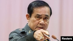 FILE - Thailand's Prime Minister Prayuth Chan-ocha gestures as he speaks during an event titled "The Instruction on the Procedures of Members of the National Reform Council" at the Army Club in Bangkok, September 4, 2014.