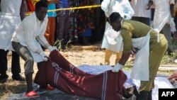 Tanzanian recovery workers remove bodies of victims of the MV Nyerere ferry disaster on Lake Victoria, Tanzania, Sept. 22, 2018.