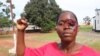 Simulação de mulher agredida na marcha contra a violência em Malanje, Angola, 9 de Dezembro de 2021