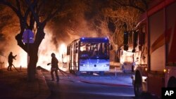 Firefighters work at a scene of fire from an explosion in Ankara, Wednesday, Feb. 17, 2016. (IHA via AP) 