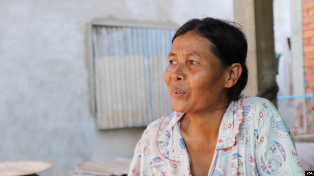 Kann Sarin, 48, a housewife a mother of four, lives in Chbar Ampov district about 30 km from Phnom Penh, on May 20, 2019. She told VOA Khmer that she wants a hospital in her village, so her family could get treatment when needed. (Phorn Bopha/ VOA Khmer)