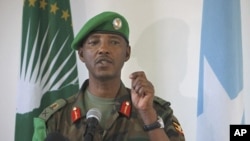 Current African Union Mission in Somalia (AMISOM) Force Commander Major General Fred Mugisha, speaks to the Somali media at the mission's headquarters in the capital Mogadishu in this handout photo taken April 26, 2012. 