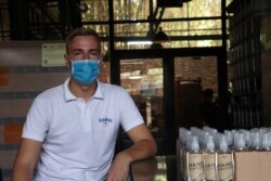 25-year-old Antoine Callet works as a production manager at Samai Distillery located in Phnom Penh, Cambodia, March 31, 2020. (Phorn Bopha /VOA Khmer)