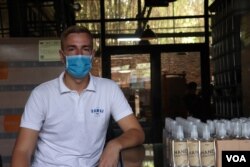 25-year-old Antoine Callet works as a production manager at Samai Distillery located in Phnom Penh, Cambodia, March 31, 2020. (Phorn Bopha /VOA Khmer)