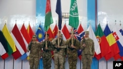NATO mengakhiri misi tempur di Afghanistan.