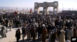 FILE - Pashtun tribesmen gather at Pakistan-Afghanistan border post at Chaman to protest against stricter border controls introduced by Pakistan, Thursday, Jan. 11, 2007 in Waish, Afghanistan.