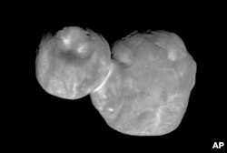 FILE - This Tuesday, Jan. 1, 2019 image made available by NASA shows the Kuiper belt object originally called "Ultima Thule," about one billion miles beyond Pluto. Photo taken by the New Horizons spacecraft.
