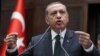 Turkish Prime Minister Recep Tayyip Erdogan addresses his supporters and lawmakers at the parliament in Ankara, Turkey, Tuesday, June 25, 2013.