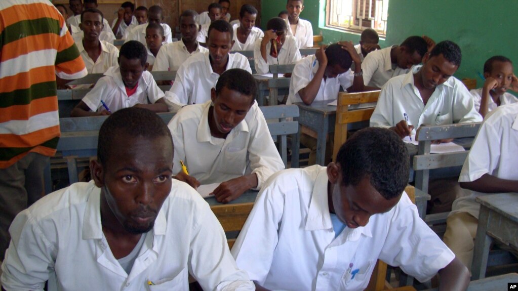 FILE - Somali students attend their annual exam in Yusuf Kowneyn secondary school in Mogadishu, Somalia.