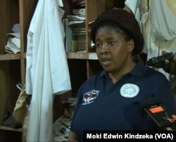 School discipline mistress Maureen Njei speaks to reporters about the kidnapping of dozens of students from the school in Bafut, near Bamenda, Cameroon, Nov. 5, 2018.