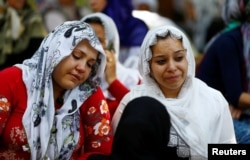 Women mourn as they wait in front of a hospital morgue in the Turkish city of Gaziantep, after a suspected bomber targeted a wedding celebration in the city, Turkey, Aug. 21, 2016.