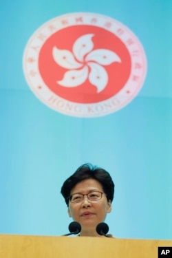 Hong Kong Chief Executive Carrie Lam speaks during a press conference at the Legislative Council in Hong Kong, Tuesday, June 18, 2019. (AP Photo/Kin Cheung)