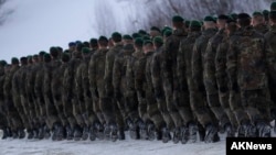 German Bundeswehr soldiers of the 122th Infantry Battalion take part in a farewell ceremony in Oberviechtach, Germany, Thursday, Jan. 19, 2017. As a part of the NATO program 'enhanced forward presence' 450 soldiers will move to Lithuania in the upcoming w