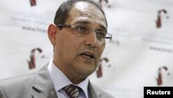 Nuri al-Abbar, chairman of the Libyan electoral commission, holds a news conference in Tripoli, June 10, 2012. 