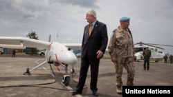 Undersecretary-General Hervé Ladsous is given briefing on drones during their official launch in Goma, Dec. 3, 2013. 